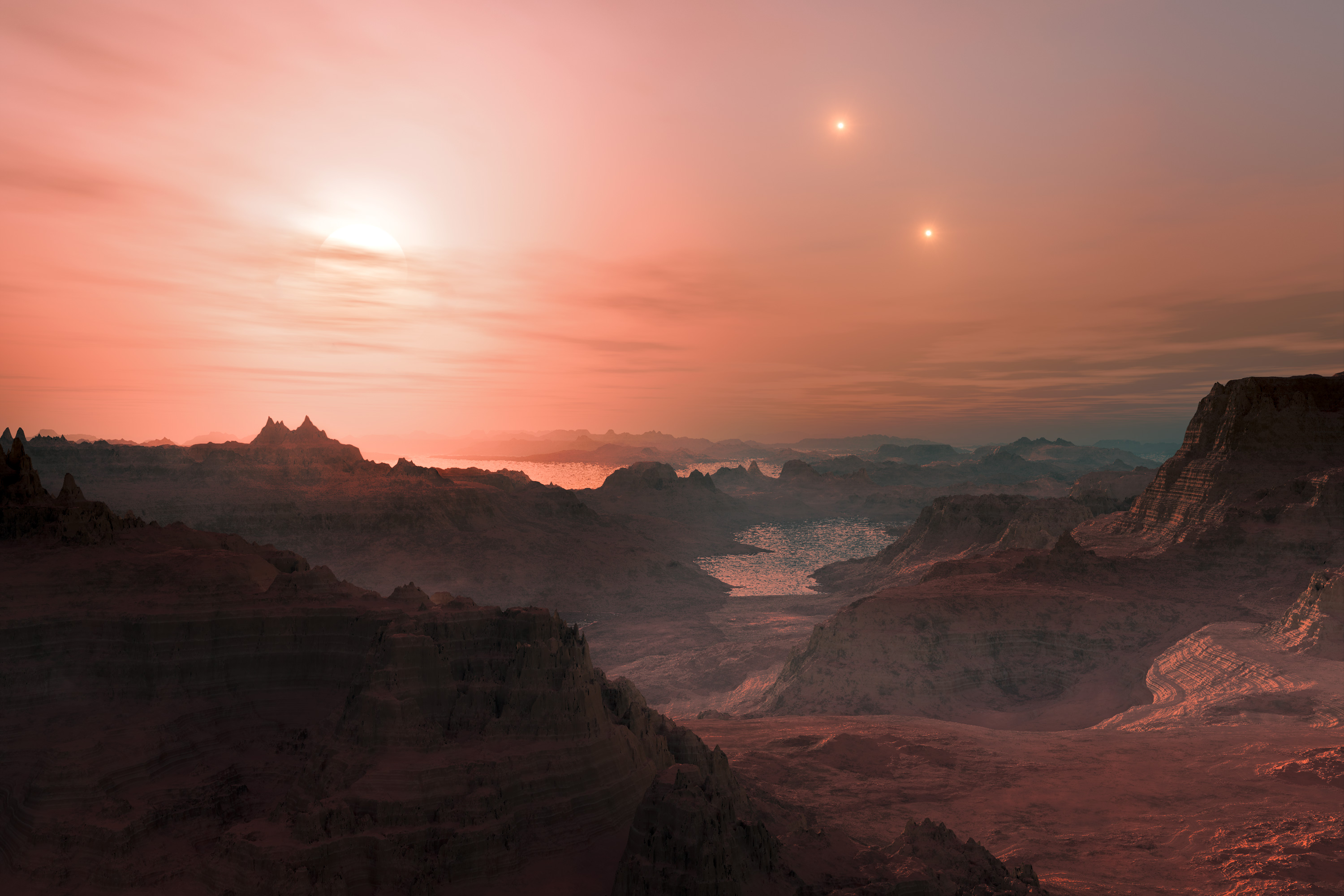 This artist’s impression shows a sunset seen from the super-Earth Gliese 667 Cc. The brightest star in the sky is the red dwarf Gliese 667 C, which is part of a triple star system. The other two more distant stars, Gliese 667 A and B appear in the sky also to the right. Astronomers have estimated that there are tens of billions of such rocky worlds orbiting faint red dwarf stars in the Milky Way alone.